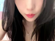 Chinese beauty masturbates on the bed